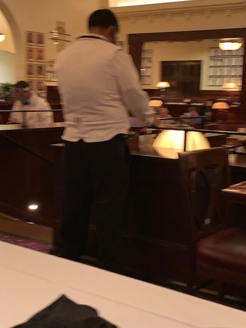 Restaurant employee with back to us